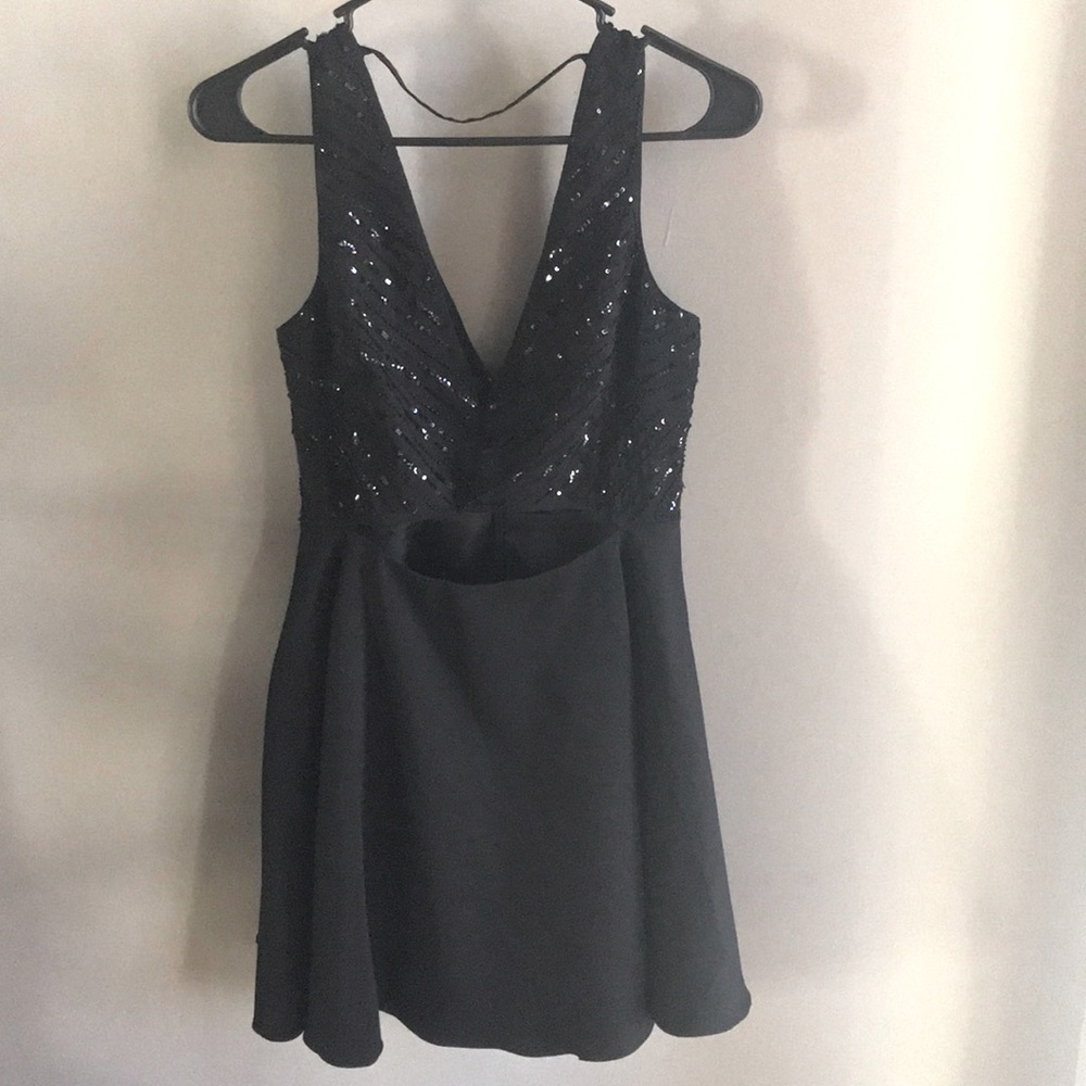 Very detailed, flare bottom, peek-a-boo dress